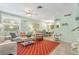 Bright and inviting living room with open layout, seamlessly flowing into the dining area at 412 80Th St, Holmes Beach, FL 34217