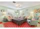 Relaxing living room with convertible sofa, coastal decor, and inviting seating arrangements at 412 80Th St, Holmes Beach, FL 34217