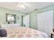 Serene main bedroom featuring a plush bed, ample closet space, and beach-themed decor at 412 80Th St, Holmes Beach, FL 34217