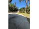 Backyard view featuring a concrete patio, lawn and shed surrounded by tropical landscaping at 4218 Carson Ne St, St Petersburg, FL 33703