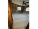 Bedroom features cinderblock walls, natural light, and exposed beams, awaiting renovation at 4218 Carson Ne St, St Petersburg, FL 33703