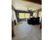 Sunlit living room with exposed cinder block walls and beams awaiting renovation and customization at 4218 Carson Ne St, St Petersburg, FL 33703