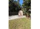 View of backyard shed with surrounded by tropical plants and trees at 4218 Carson Ne St, St Petersburg, FL 33703