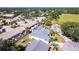 Expansive aerial view of the property and lush neighborhood with well-maintained homes at 4822 Hamlets Grove Dr, Sarasota, FL 34235