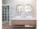 Stylish bathroom with dual sinks, modern floating cabinets, and a contemporary design at 4822 Hamlets Grove Dr, Sarasota, FL 34235