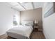 Bright bedroom featuring modern decor, a comfortable bed, and an airy ambiance at 4822 Hamlets Grove Dr, Sarasota, FL 34235