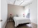 Cozy bedroom features neutral tones, bright natural light, and minimalist decor at 4822 Hamlets Grove Dr, Sarasota, FL 34235