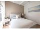 Bright bedroom featuring modern decor, a comfortable bed, and an airy ambiance at 4822 Hamlets Grove Dr, Sarasota, FL 34235