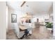 Bright, open dining room leading to kitchen and living area, featuring elegant decor and tile flooring at 4822 Hamlets Grove Dr, Sarasota, FL 34235