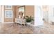 Inviting entryway featuring a stylish buffet adorned with decorative vases and a lush green plant, creating a warm welcome at 4822 Hamlets Grove Dr, Sarasota, FL 34235