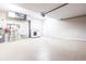 Bright garage with new epoxy flooring, laundry area, and storage options for convenience at 4822 Hamlets Grove Dr, Sarasota, FL 34235