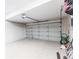 Spacious garage with epoxy flooring and garage door with automatic opener, offering ample storage at 4822 Hamlets Grove Dr, Sarasota, FL 34235