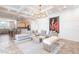 Open-concept living area with modern furnishings, a chandelier, and abundant natural light at 4822 Hamlets Grove Dr, Sarasota, FL 34235