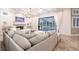 Cozy living room featuring a modern fireplace and seamless access to a private pool area through sliding glass doors at 4822 Hamlets Grove Dr, Sarasota, FL 34235