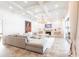 Bright, expansive living room with coffered ceilings, a fireplace, and neutral décor at 4822 Hamlets Grove Dr, Sarasota, FL 34235
