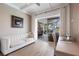 Bright living room features a patio, offering seamless indoor-outdoor living and natural light at 4822 Hamlets Grove Dr, Sarasota, FL 34235