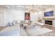 Bright living room features coffered ceilings, fireplace, and a comfortable sectional sofa, perfect for relaxation at 4822 Hamlets Grove Dr, Sarasota, FL 34235