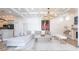 Bright living room features coffered ceilings, fireplace, and a comfortable sectional sofa, perfect for relaxation at 4822 Hamlets Grove Dr, Sarasota, FL 34235