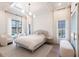 Serene main bedroom with ample natural light, neutral tones, and access to outdoor area at 4822 Hamlets Grove Dr, Sarasota, FL 34235