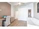 A spacious office area boasts light wood floors, custom shelving, and abundant natural light at 4822 Hamlets Grove Dr, Sarasota, FL 34235