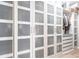 Spacious walk-in closet featuring custom shelving and frosted-door storage at 4822 Hamlets Grove Dr, Sarasota, FL 34235