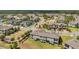 An aerial view shows the community layout, complete with lush landscaping and serene water features at 4828 San Martino Dr, Wesley Chapel, FL 33543