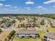 An aerial view showcases the stunning community layout with lush landscaping and serene water features at 4828 San Martino Dr, Wesley Chapel, FL 33543