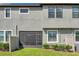 The backyard has green grass, a screened in porch and partial fencing at 4828 San Martino Dr, Wesley Chapel, FL 33543