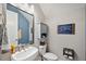 Stylish powder room with modern fixtures, pedestal sink, and attractive decor at 4828 San Martino Dr, Wesley Chapel, FL 33543