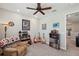 The bonus room includes a ceiling fan and is setup as a music room at 4828 San Martino Dr, Wesley Chapel, FL 33543