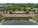Community entrance with stone signage and lush landscaping provides a welcoming first impression reflecting quality and prestige at 4828 San Martino Dr, Wesley Chapel, FL 33543