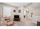 Second floor loft area with a stacked stone wall and comfortable seating at 4828 San Martino Dr, Wesley Chapel, FL 33543