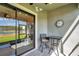 The covered patio features comfortable seating and views of the outdoor space at 4828 San Martino Dr, Wesley Chapel, FL 33543