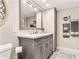 Stylish bathroom featuring modern vanity, large mirror, and elegant fixtures at 4900 Brittany S Dr # 811, St Petersburg, FL 33715
