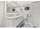 Bathroom vanity with marble countertop, double sinks, ample storage and modern fixtures at 4900 Brittany S Dr # 811, St Petersburg, FL 33715