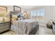 Bedroom with wood flooring and view of the water from the window at 4900 Brittany S Dr # 811, St Petersburg, FL 33715