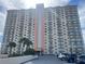 Modern condo building boasting multiple balconies and parking area at 4900 Brittany S Dr # 811, St Petersburg, FL 33715