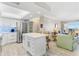 Bright kitchen with stainless appliances, stylish island with seating, and an open concept to the living space at 4900 Brittany S Dr # 811, St Petersburg, FL 33715