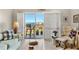 Bright living room with comfortable seating, stylish decor, and a sliding door that leads to the balcony at 4900 Brittany S Dr # 811, St Petersburg, FL 33715