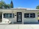 Welcoming front entrance featuring decorative columns and a secure screen door at 547 16Th S Ave, St Petersburg, FL 33701