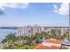 Stunning aerial view showcasing waterfront condos with tropical landscaping and serene water views at 6287 Bahia Del Mar Cir # 801, St Petersburg, FL 33715