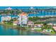 An aerial view showcases this waterfront property with a pier, pools, and surrounding waterways at 6287 Bahia Del Mar Cir # 801, St Petersburg, FL 33715