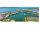 Breathtaking aerial view showcases condos, lush landscaping, and a picturesque fountain in a tranquil setting at 6287 Bahia Del Mar Cir # 801, St Petersburg, FL 33715