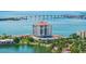 Stunning aerial view of the condo building, showing surrounding waterways, landscaping, and bridge at 6287 Bahia Del Mar Cir # 801, St Petersburg, FL 33715