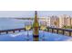 Scenic water view from the balcony with a bottle of wine and glasses at 6287 Bahia Del Mar Cir # 801, St Petersburg, FL 33715