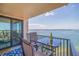 Balcony with seating and a glass table, perfect for enjoying waterfront views at 6287 Bahia Del Mar Cir # 801, St Petersburg, FL 33715