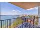 Balcony furniture with beautiful water views and a table with chairs at 6287 Bahia Del Mar Cir # 801, St Petersburg, FL 33715