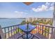 Balcony view of the water with seating for two at a glass-topped table at 6287 Bahia Del Mar Cir # 801, St Petersburg, FL 33715