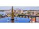 Balcony table set for two with a bottle of wine and water views at 6287 Bahia Del Mar Cir # 801, St Petersburg, FL 33715