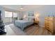 Inviting bedroom with a walk-out balcony, lamps, and chest of drawers at 6287 Bahia Del Mar Cir # 801, St Petersburg, FL 33715